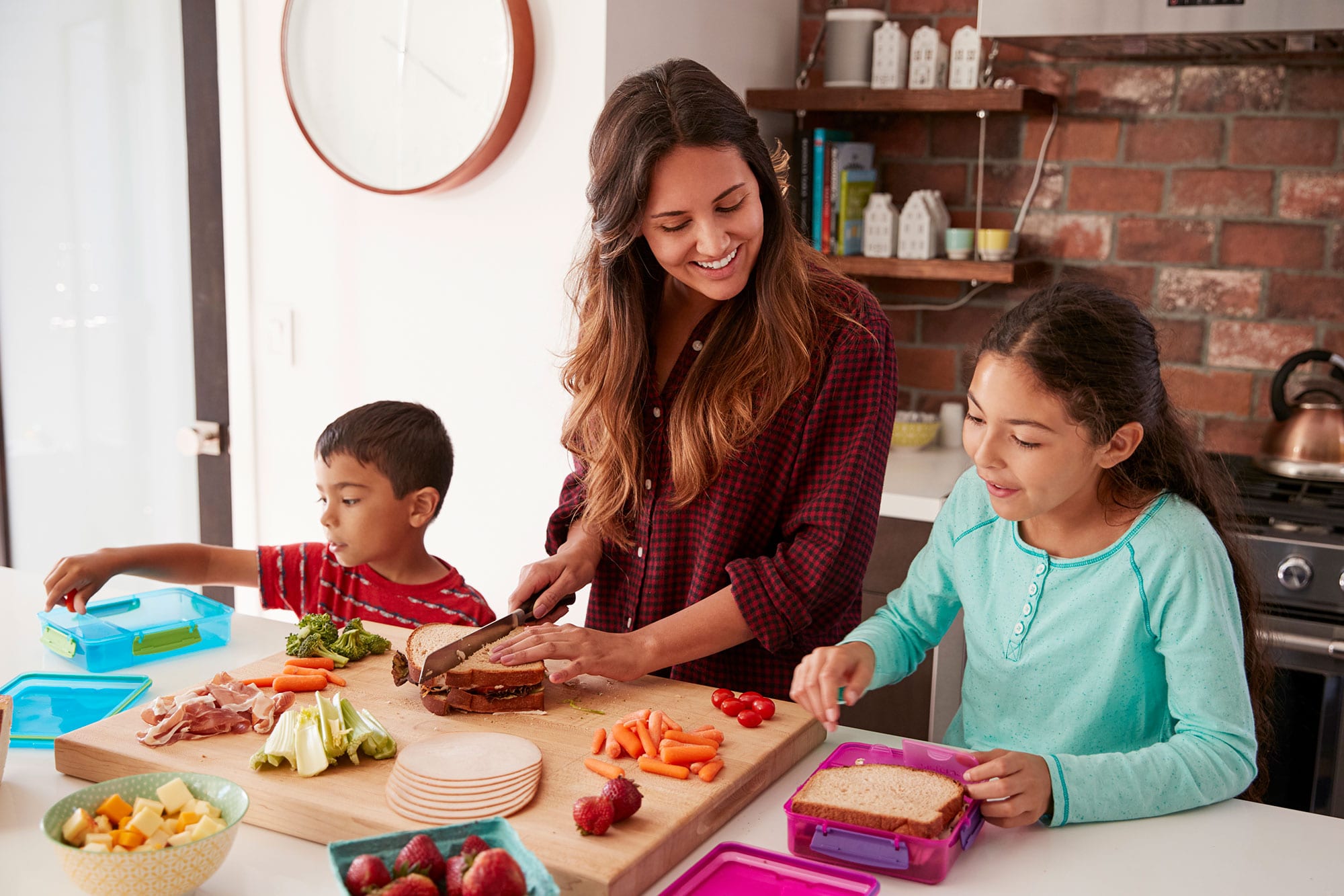 children help mother make school lunches