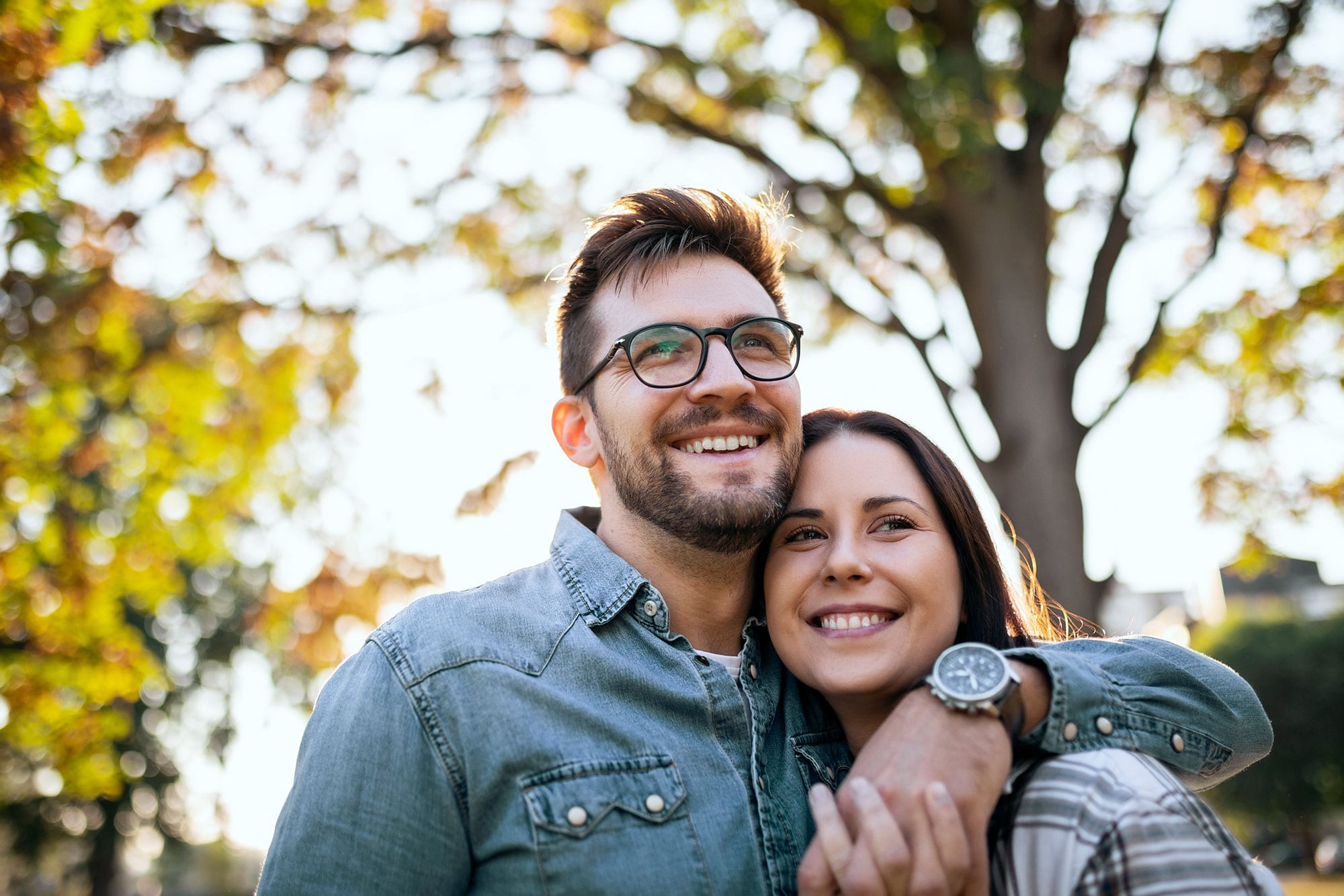 Young Couple and Autumn sunny day