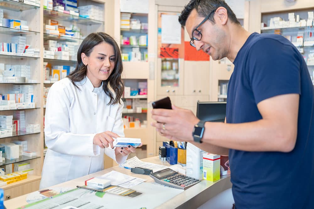 photo of a customer consulting with a pharmacist